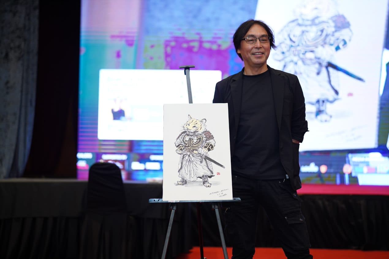 Ink drawing of an armored cat displayed on a stage easel